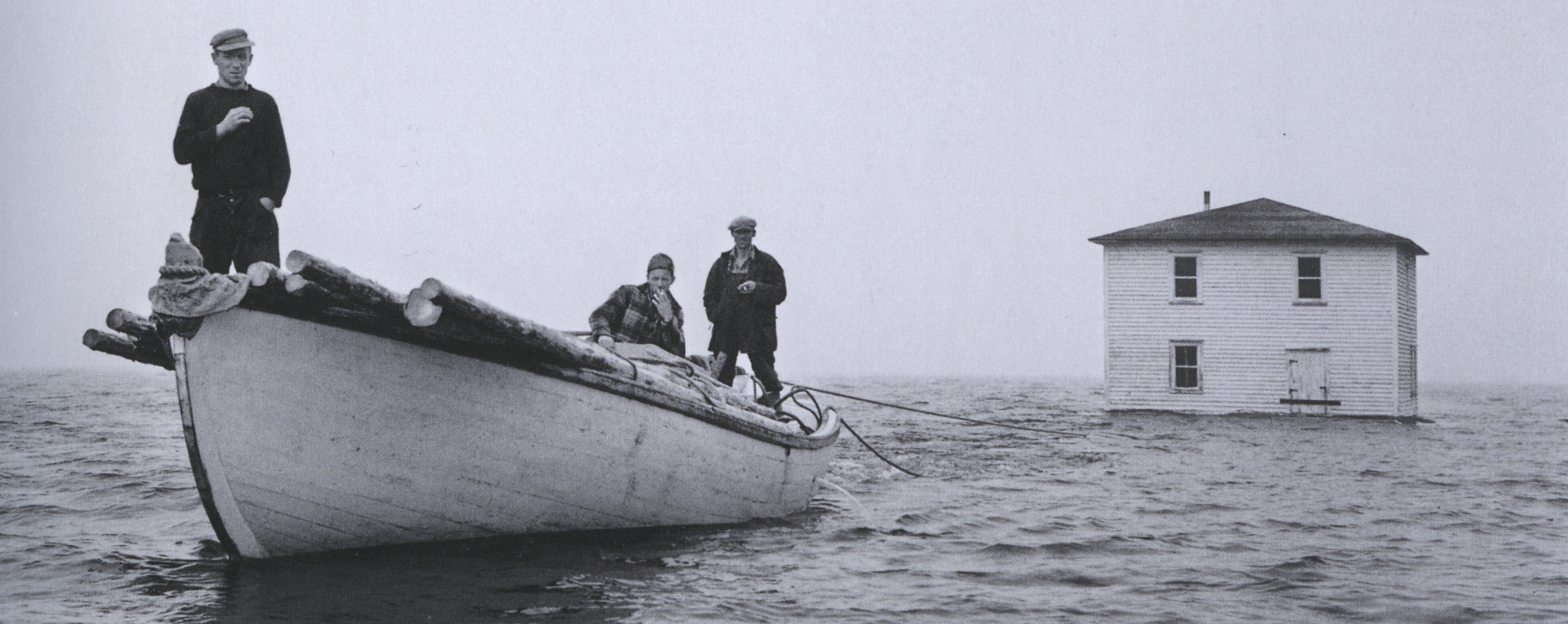 House of M. Rogers being towed to Flat Island, Nwfld_1961